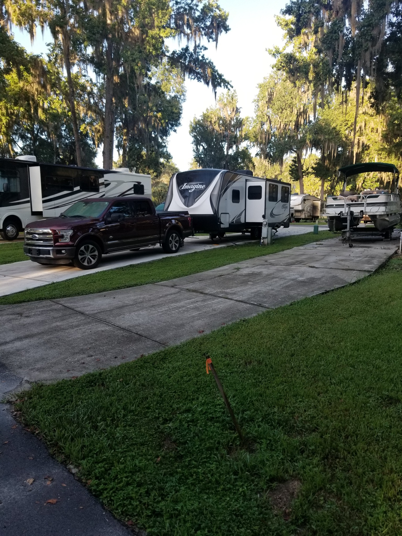 Our truck and Grand Design travel trailer on concrete site 106 at Ocala North