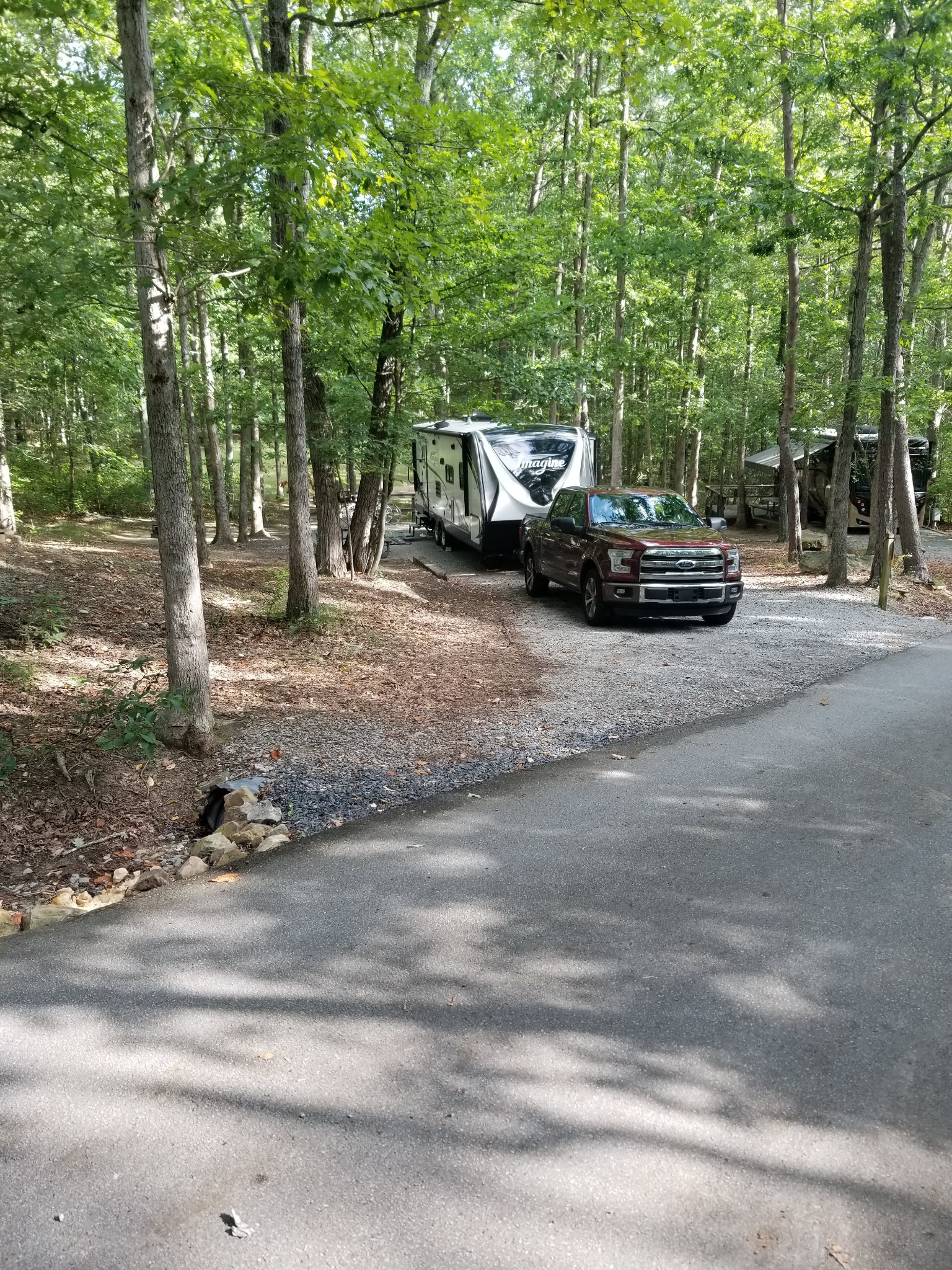Our Grand Design travel trailer and truck at a wooded Cloudland Canyon campsite