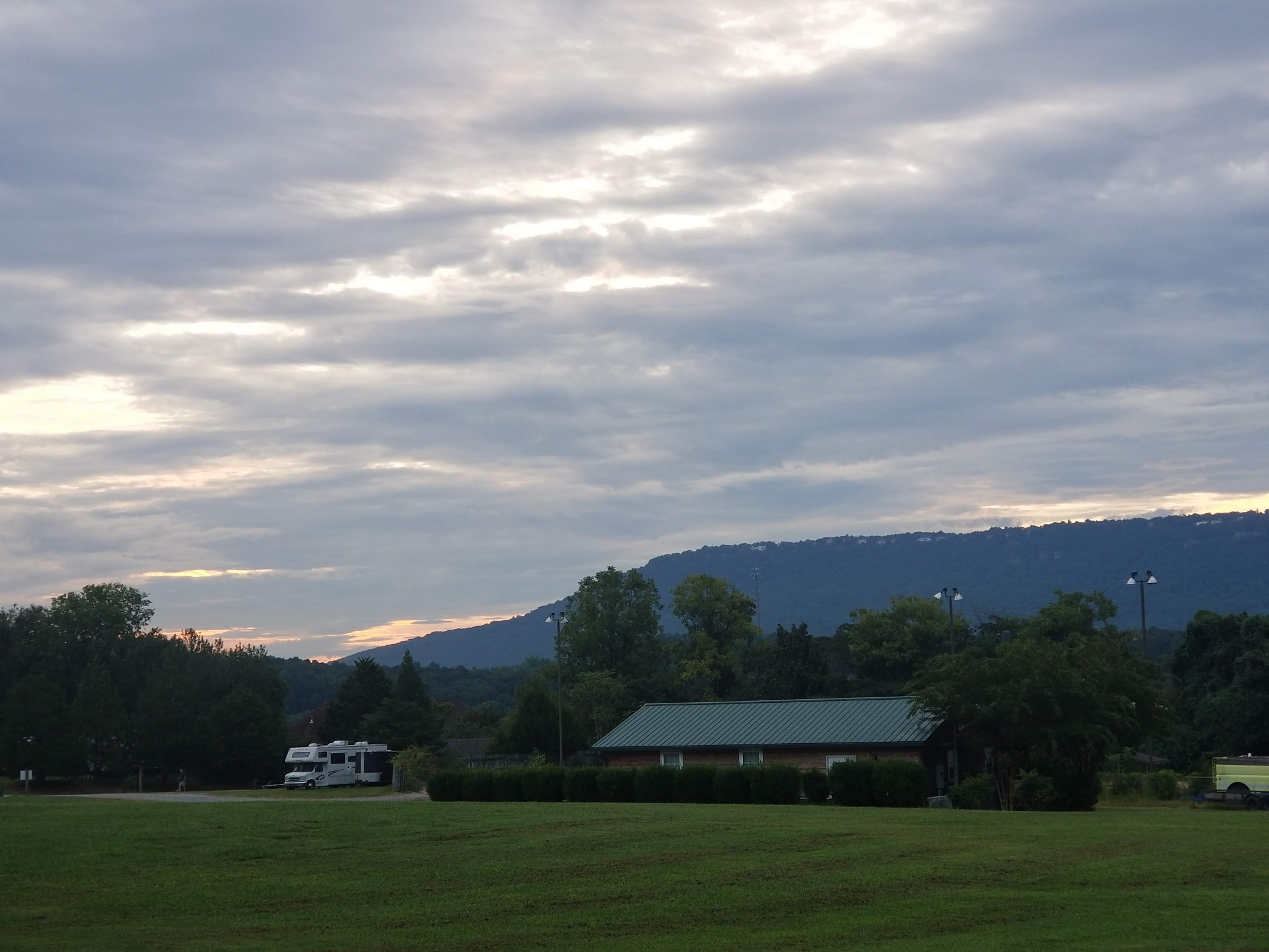 Cloudy morning sky above the campground and mountain ridge
