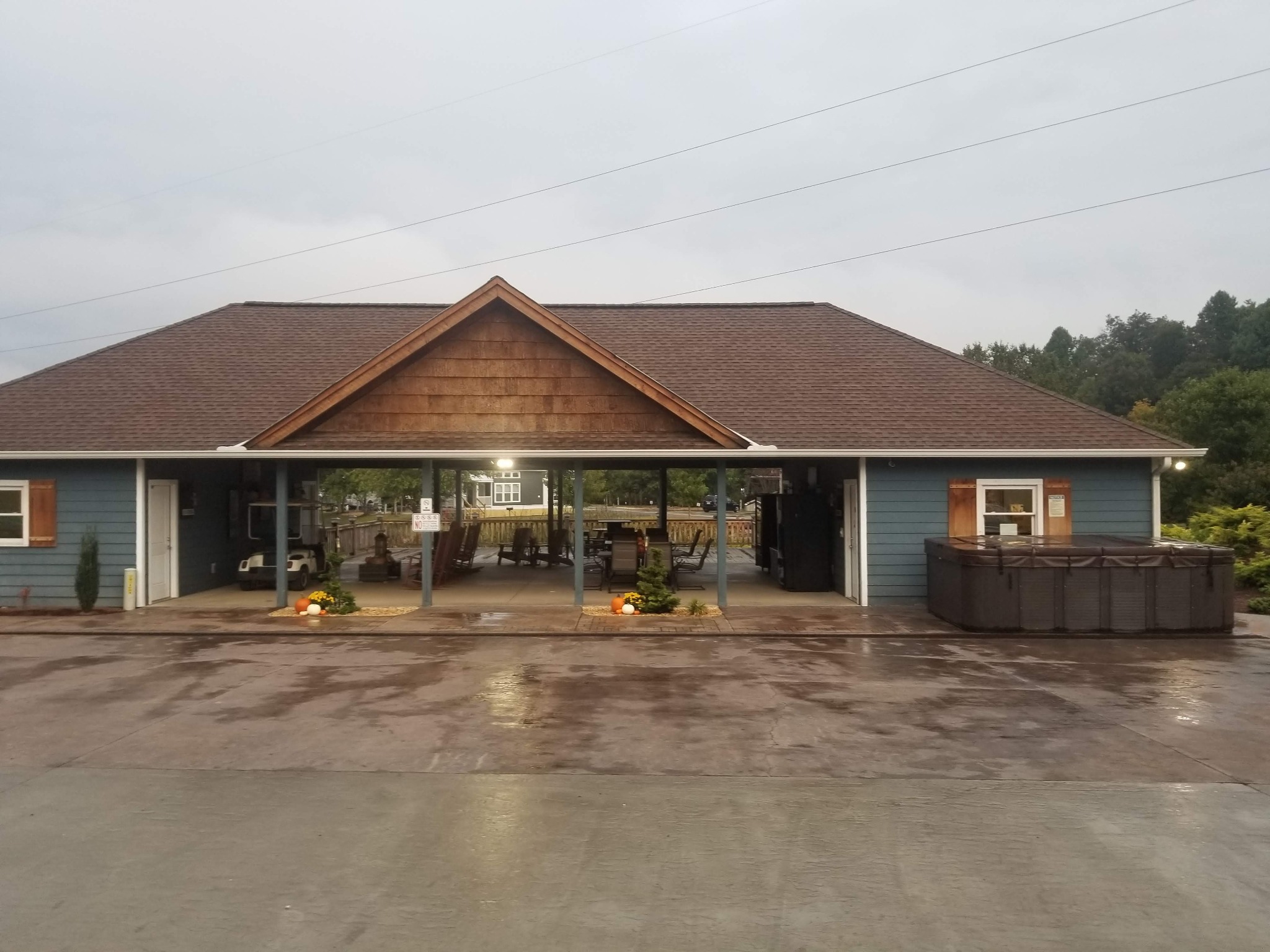 Covered gathering area and campground buildings at Waterside at Blue Ridge