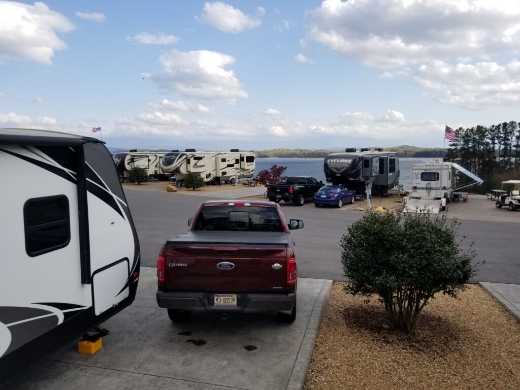 Travel trailer and pickup truck at an RV campsite